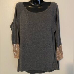 Grey long sleeve, high/low t-shirt with champagne sequin cuffs. Size small